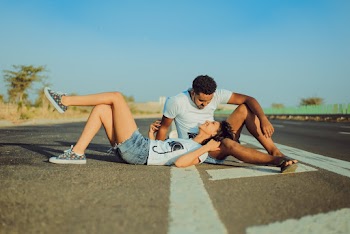 Photo Of Woman Laying On Man's Lap