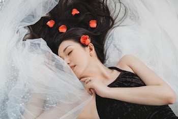 Photo Of Woman Laying On Veil