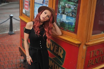 Photo of Woman Leaning on a Ticket Booth
