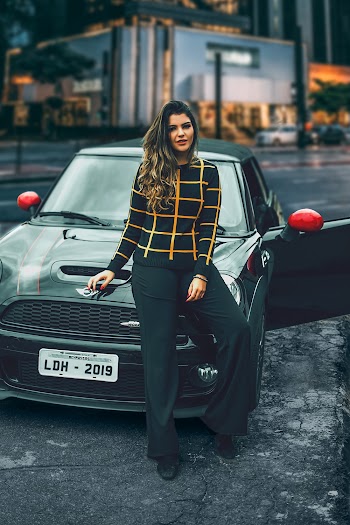 Photo of Woman Leaning On Car