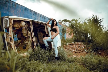 Photo of Woman Leaning on Car