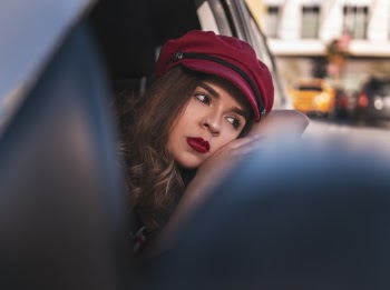 Photo Of Woman Leaning On Car Window