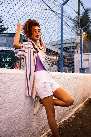 Photo of Woman Leaning on Chain-Link Fence