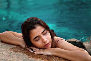 Photo Of Woman Leaning On Concrete Surface