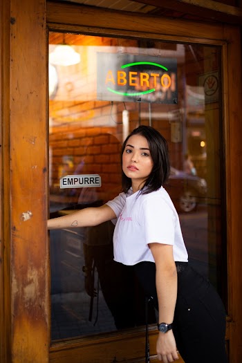 Photo of Woman Leaning on Door