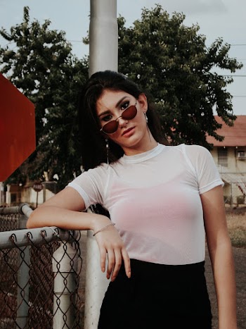 Photo of Woman Leaning On Fence