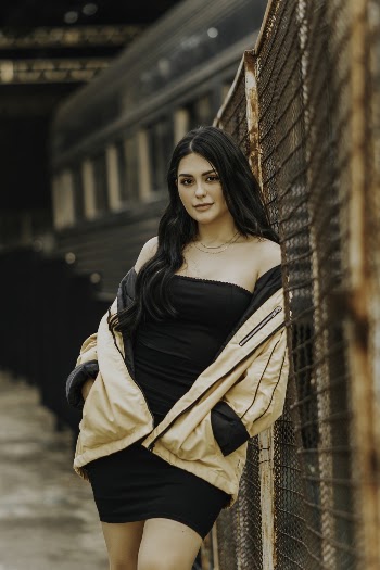 Photo Of Woman Leaning On Fence
