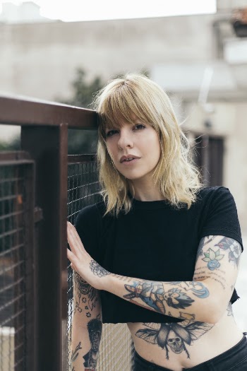 Photo of Woman Leaning On Fence