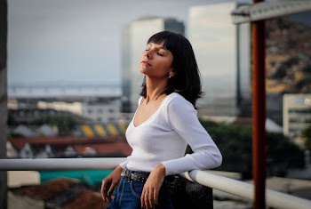Photo Of Woman Leaning On Fence