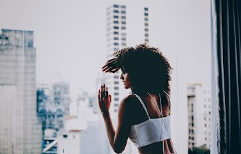 Photo Of Woman Leaning On Glass