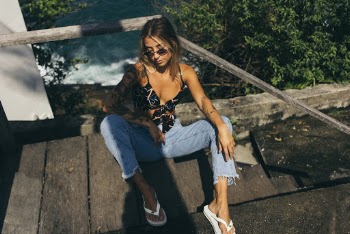 Photo of Woman Leaning on Hand Rail