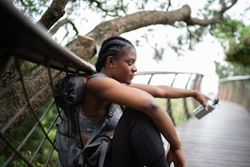 Photo Of Woman Leaning On Handrail