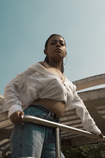 Photo of Woman Leaning on Handrail