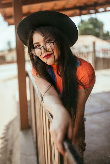 Photo Of Woman Leaning On Handrail