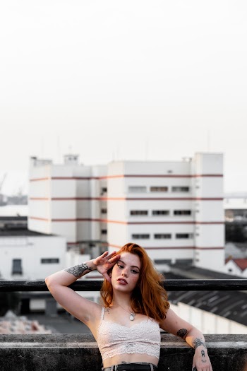 Photo Of Woman Leaning On Handrail