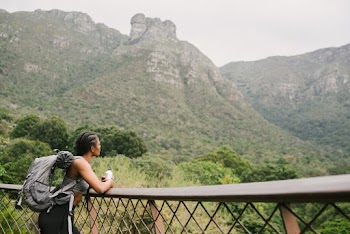 Photo Of Woman Leaning On Handrail
