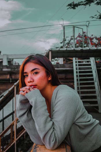 Photo Of Woman Leaning On Handrail