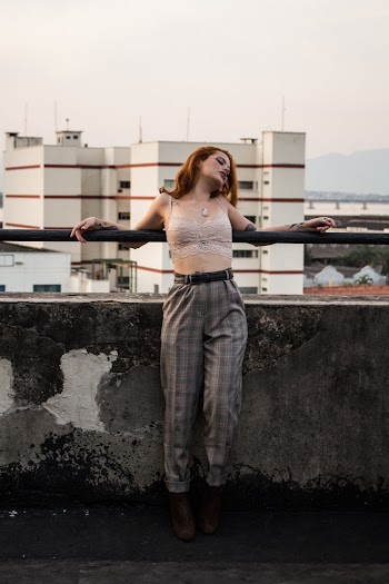 Photo Of Woman Leaning On Handrail