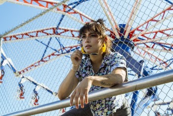 Photo of Woman Leaning on Handrail