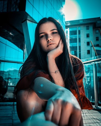 Photo of Woman Leaning on Her Chin