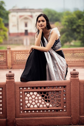 Photo of Woman Leaning on Railing