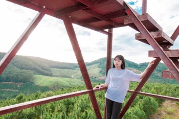 Photo of Woman Leaning On Steel Frame