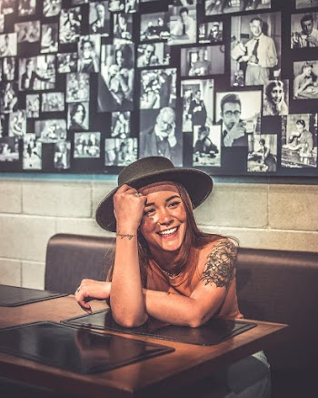 Photo of Woman Leaning on Table
