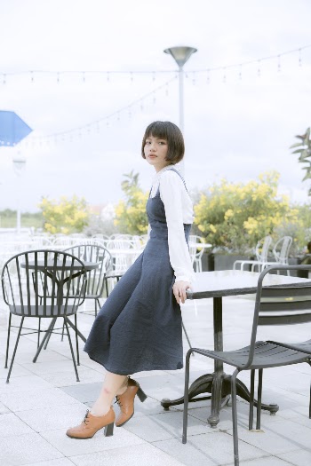 Photo of Woman Leaning On Table