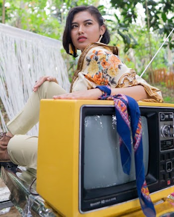 Photo Of Woman Leaning On Television