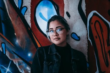 Photo Of Woman Leaning On The Wall