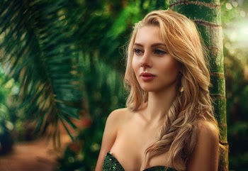 Photo of Woman Leaning On Tree