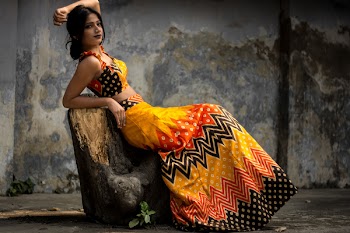 Photo of Woman Leaning on Tree Trunk
