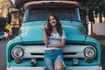 Photo of Woman Leaning on Vehicle