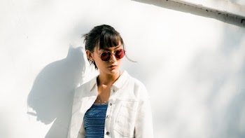 Photo Of Woman Leaning On Wall