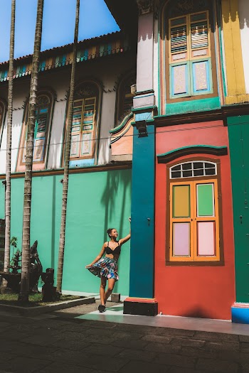 Photo of Woman Leaning on Wall