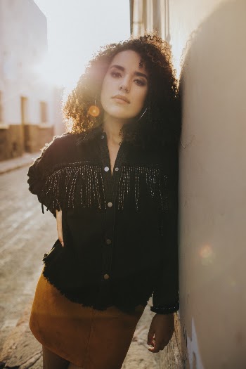 Photo Of Woman Leaning On Wall