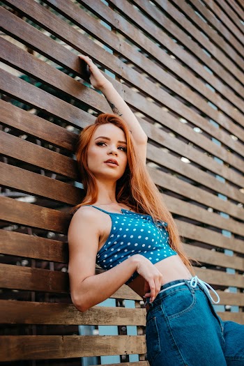 Photo Of Woman Leaning On Wall