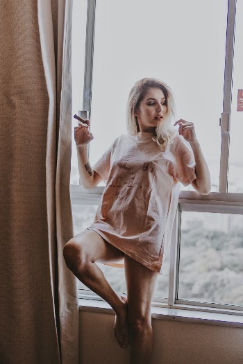 Photo Of Woman Leaning On Window