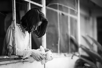 Photo Of Woman Leaning On Window