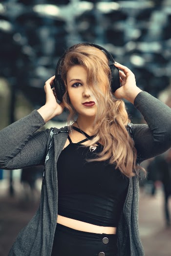 Photo Of Woman Listening To Music
