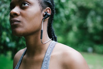 Photo of Woman Listening With Her Earphones