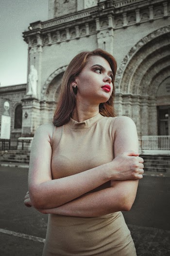 Photo of Woman Looking Away With Her Arms Crossed 