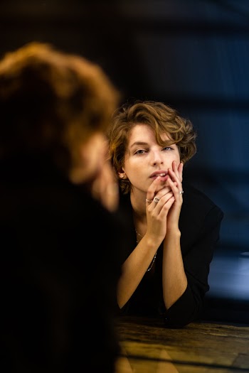 Photo Of Woman Looking In The Mirror