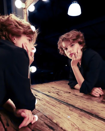 Photo of Woman Looking On The MIrror