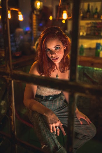 Photo Of Woman Looking Through Glass Window
