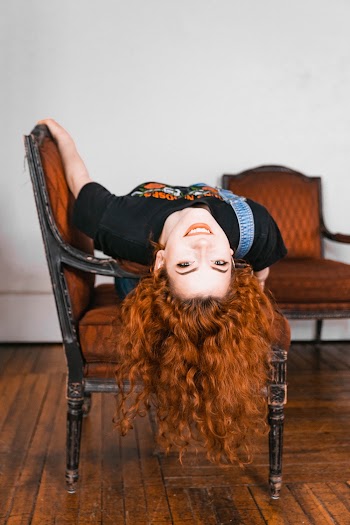 Photo of Woman Lying on Chair