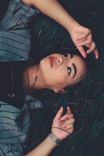 Photo Of Woman Lying On Ground