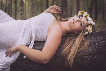 Photo of Woman Lying on Tree Bark