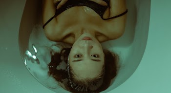 Photo of Woman Lying on Water