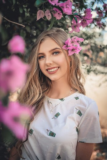 Photo Of Woman Near Flowers
